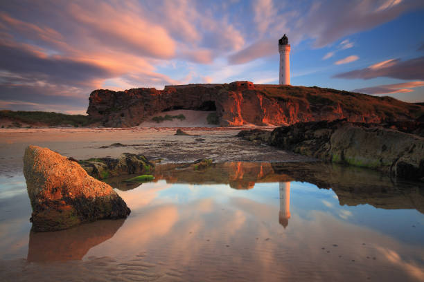 Amazing sunset over the Lossiemouth lighthouse stock photo