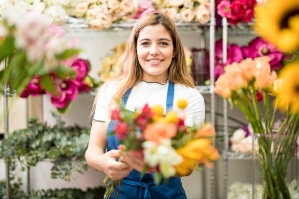istock Cute flower expert showing a bouquet 686288816