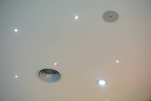istock Modern office ceiling with air duct and lamps 686294818