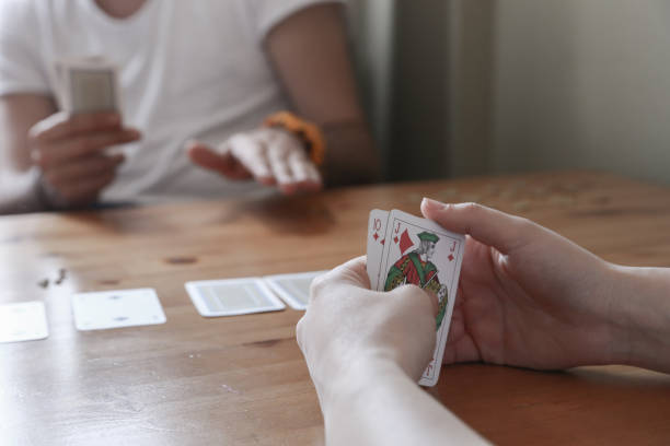 istock People playing poker on the table 686295370