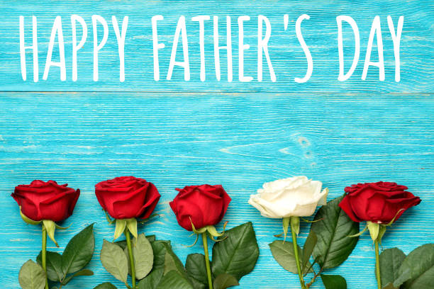 istock happy father's day, red and white roses on turquoise table 686302026
