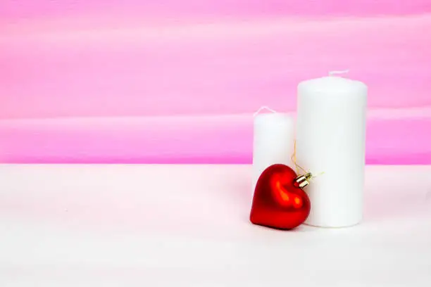red heart and white candles with pink striped background