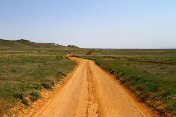istock Dry dirt road in steppe 686312220