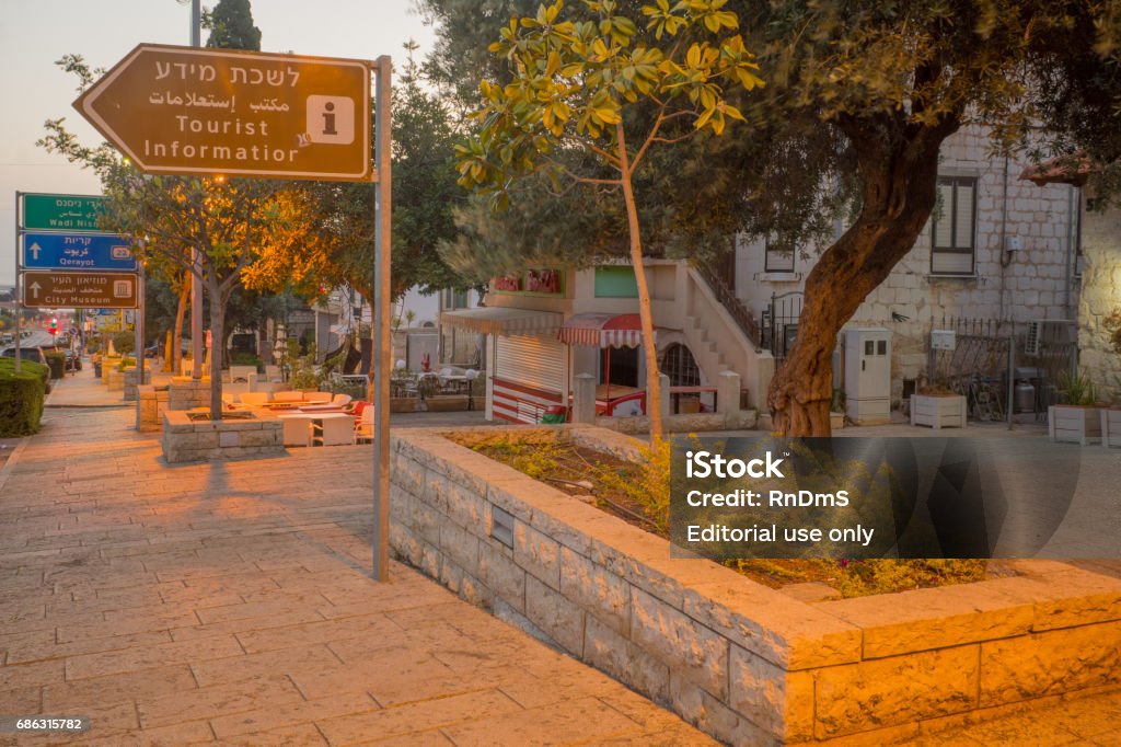 German Colony at sunrise, in Haifa Haifa, Israel - May 16, 2017: View of signs, restaurants and historic houses in the German Colony at sunrise, in Haifa, Israel. It was established in Haifa in 1868 by the German Templers, and now restored as a commercial and restaurant area Architecture Stock Photo