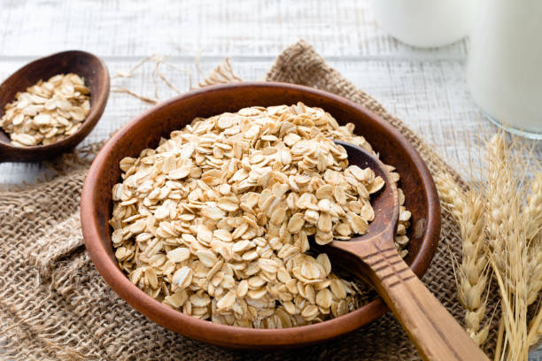 istock Rolled oats or oat flakes in bowl 686318672