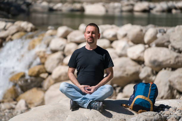 istock The Turkish man is doing yoga on the rocks 686320854