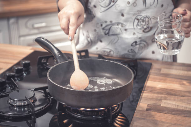istock Preparing food in frying pan. 686321314