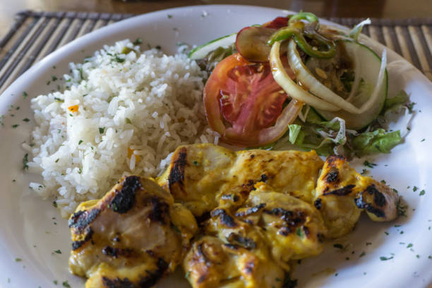 istock One portion chicken with rice and salad 686322584
