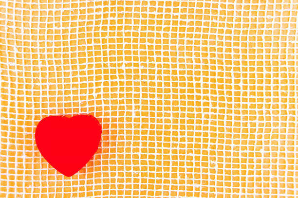 Postcard by yourself with heart. Textile greeting card with a red heart.