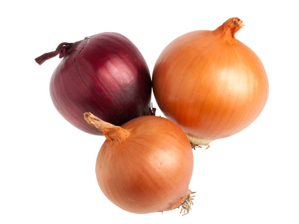 istock Red and gold onions on white background 686350008
