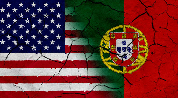 istock USA and Portugal flag together, with dried soil texture 686359874