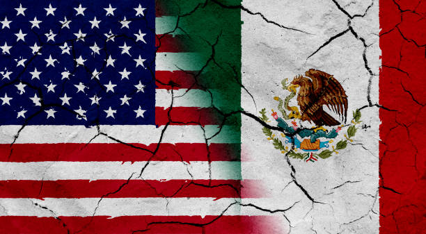 istock USA and Mexico flag together, with dried soil texture 686359890