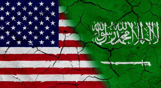 istock USA and Saudi Arabia flag together, with dried soil texture 686359894