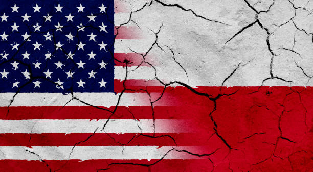 istock USA and Poland flag together, with dried soil texture 686359904