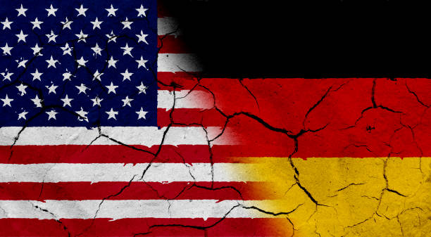 istock USA and Germany flag together, with dried soil texture 686359956