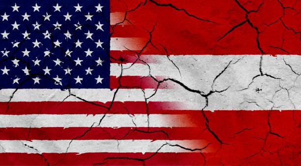 istock USA and Austria flag together, with dried soil texture 686360012