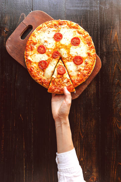 istock Hot Homemade Pepperoni Pizza Ready to Eat. natural light 686360112