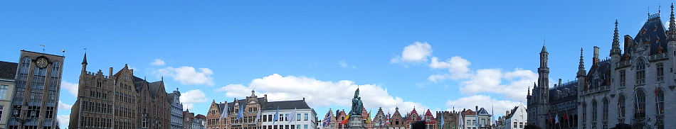 panoramic view of Belgian skyline with blue sky and white clouds