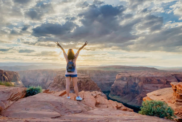 istock Standing with victory sign at Horseshoe Bend Arizona 686366894
