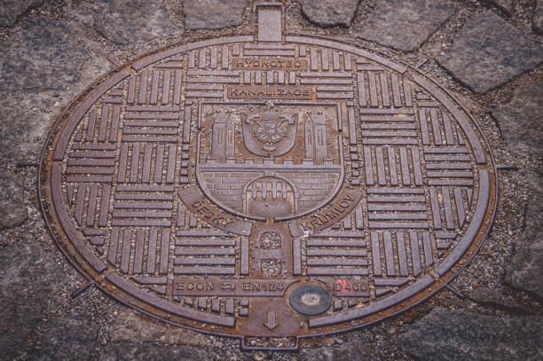 Old cast-iron sewer hatch. Czech Republic, Cesky Krumlov