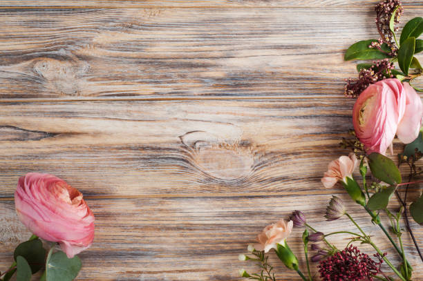 istock Flower decor on wooden background 686389810