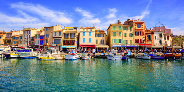 Cassis old town port promenade, Provence, France Colorful traditional houses on the promenade in the port of Cassis town near Marseilles, Provence, France marseille stock pictures, royalty-free photos & images