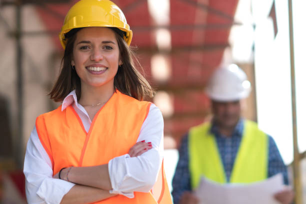 istock Portrait of confident female construction worker at construction site 686395284