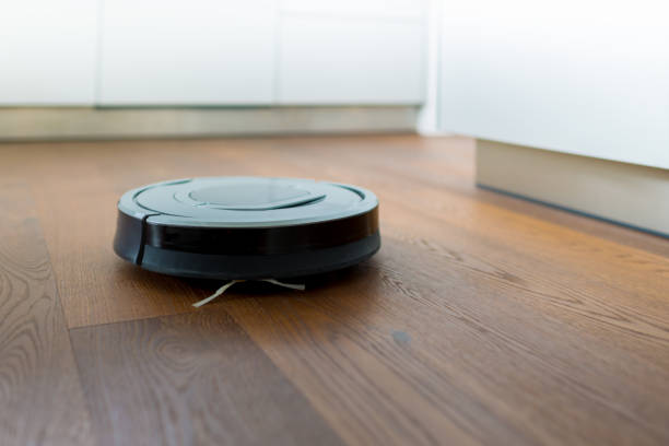 istock Robotic Vacuum Cleaner in Smart Home Kitchen 686400726