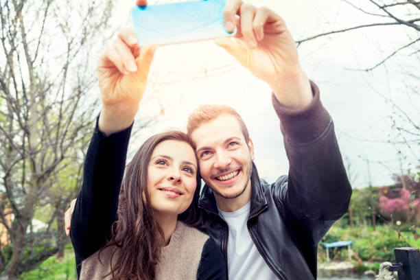 istock nice couple boyfriends takes a selfie 686410256