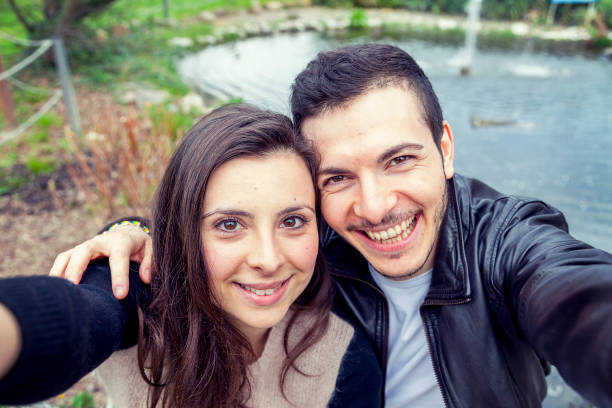 istock nice couple boyfriends takes a selfie 686412632