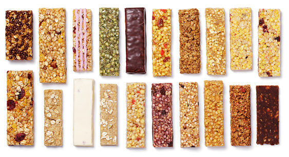 Top view of various healthy granola bars (muesli or cereal bar). Set of protein bar isolated on white background