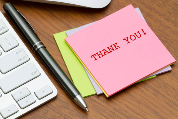 istock THANK YOU word written on a sticky note near computer keyboard. 686413036