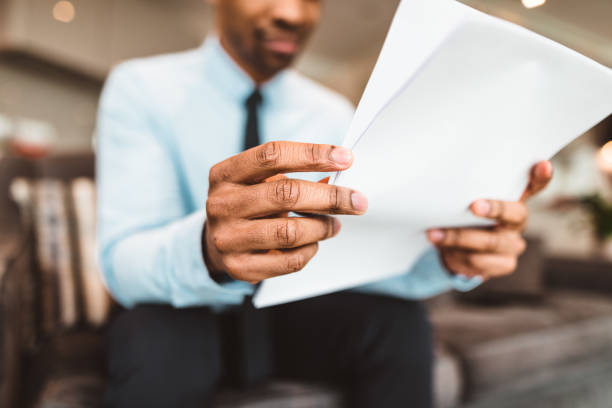 istock businessman reading rading the bills at home 686415526