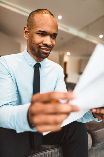 istock businessman reading rading the bills at home 686415538