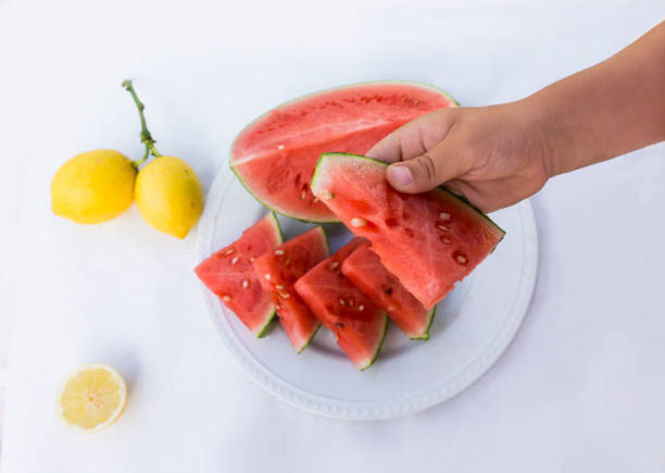 istock Holding a slice of watermelon 686416162