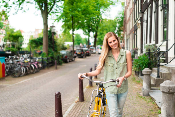 istock blonde woman walking in amsterdam 686416476