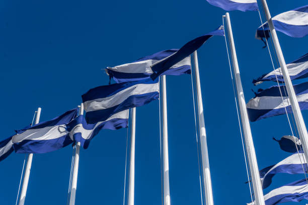 istock nicaragua flags on blue sky at background 686423376