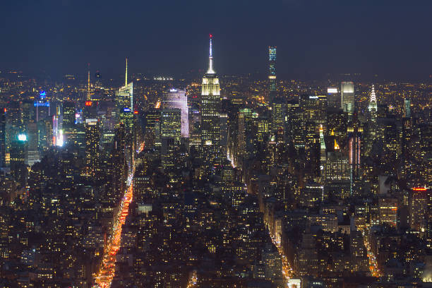 Night aerial view of midtown Manhattan island with clear sky