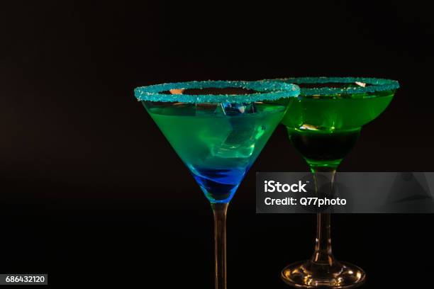 Colorful Drink In A Cocktail Glass With Ice Cubes Summer Drink Stock Photo - Download Image Now