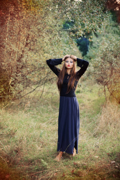 istock young beautiful women in autumn forest 686435972