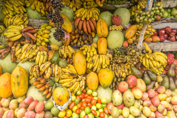 Fruits shop on tropical marketplace stock photo