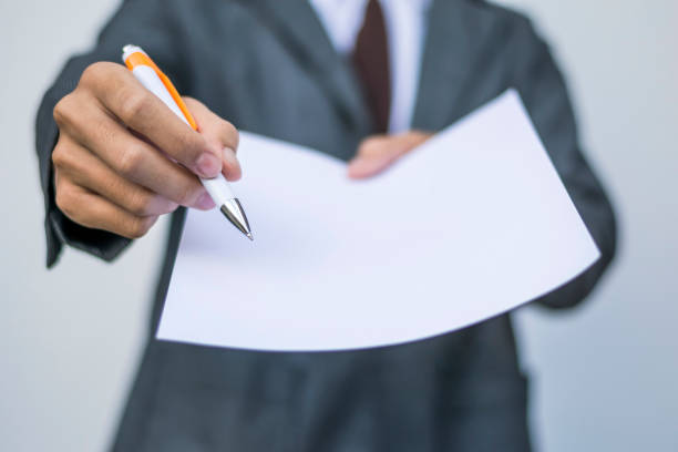 istock Business man give white paper for sign 686445870