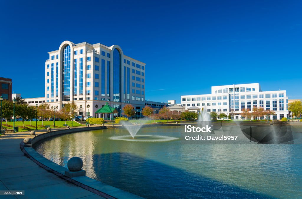 Newport News Skyline with Fountains Newport News office buildings with multiple fountains and a lake.  Newport News is part of the Hampton Roads / Virginia Beach area. Virginia - US State Stock Photo