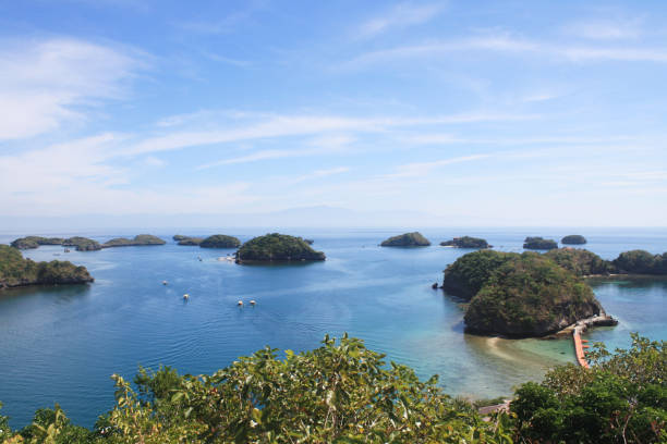 istock Group of islets (small islands) in blue waters with clear blue sky and beautiful trees 686452616