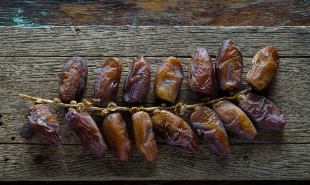 istock date palm ,Date fruits on wood 686452938