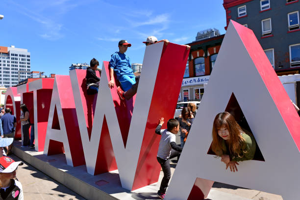Inspiration Village opens in Ottawa Ottawa, Canada - May 20, 2017:  Children play on the new Ottawa sign installed at Inspiration Village, a temporary attraction with  special exhibits and performing arts events built to help celebrate Canada’s 150th anniversary year.  It will be open starting today on York Street in the Byward Market until September 4th. 150th anniversary stock pictures, royalty-free photos & images