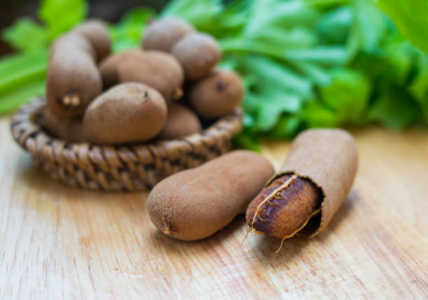 istock tamarind fruit on wooden table 686458720
