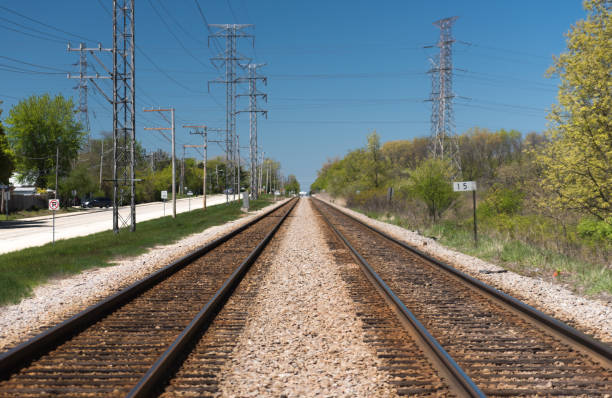 istock Rail road and electrical poles in a suburban area 686461596