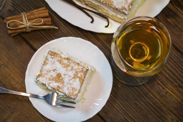 istock Handmade cream pie with whipped cream. Served with white wine in glasses 686474452