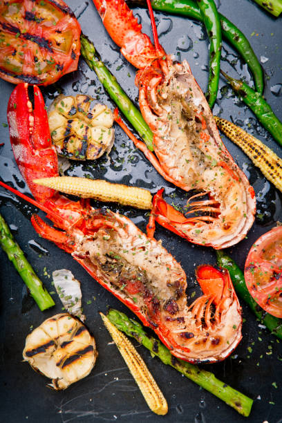 deliziosa aragosta fresca cotta e grigliata - lobster steak lobster tail main course foto e immagini stock